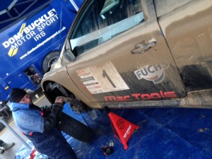 Paul Bird's car receives a check over at service by a member of the team.